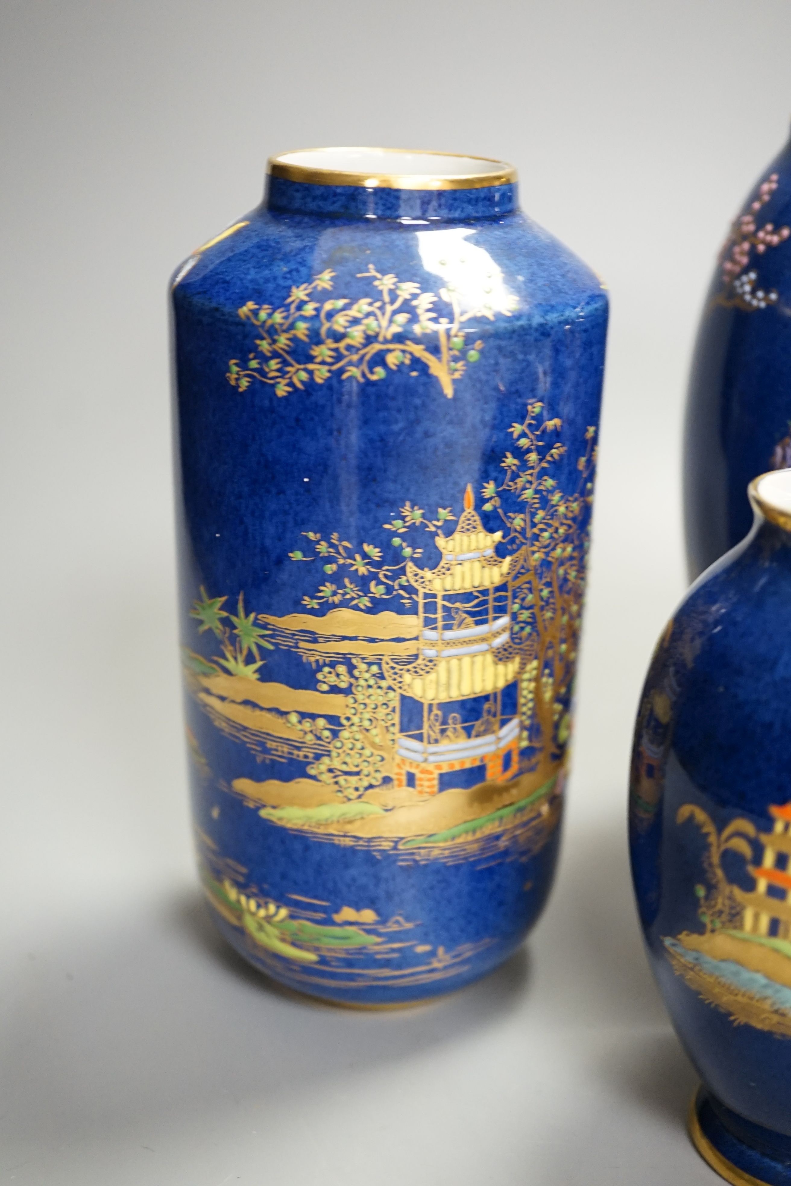 A group of Carlton ware blue ground chinoiserie lustre vases, tallest 18cm (5)